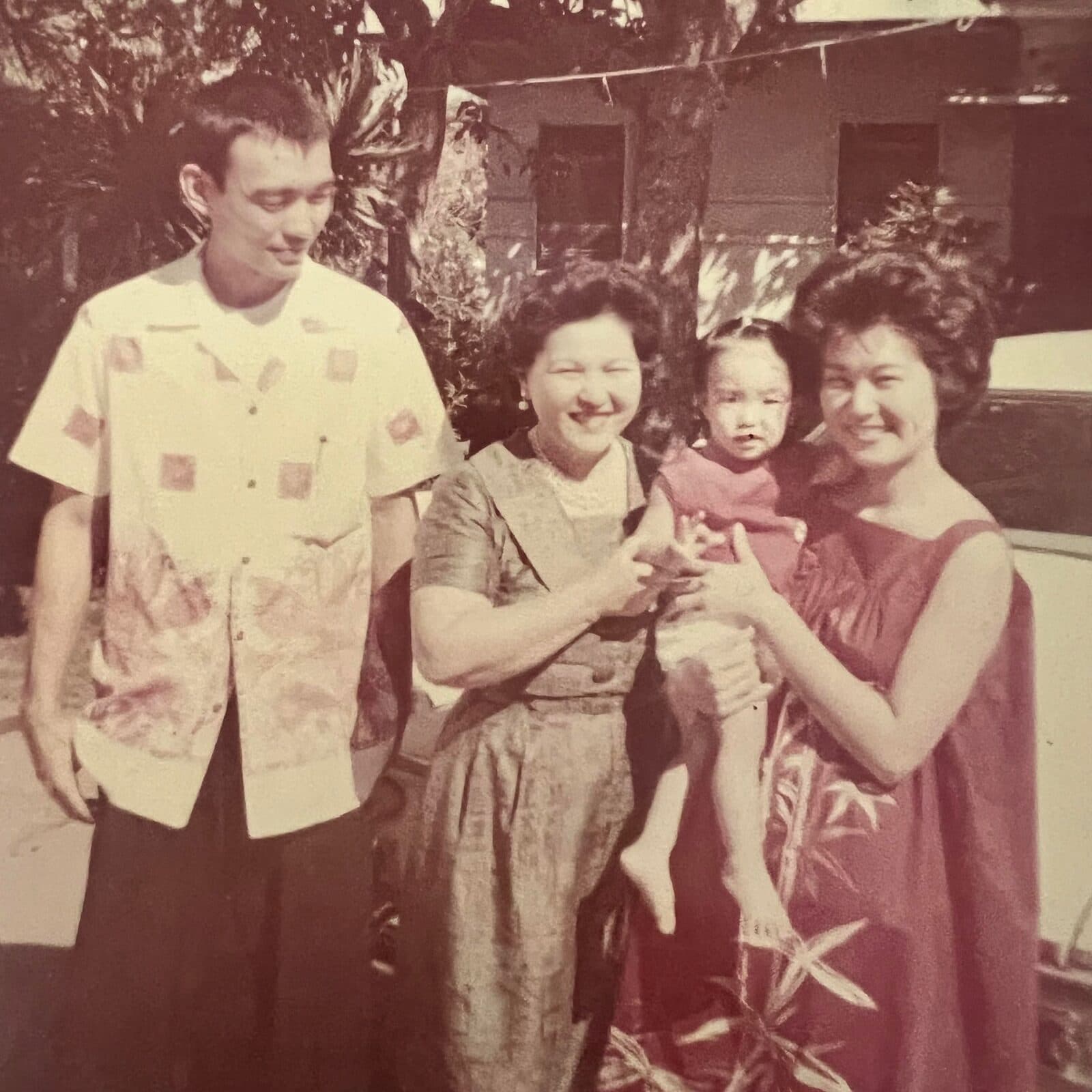 Michele as a baby with her parents and grandmother in Honolulu, 1962.